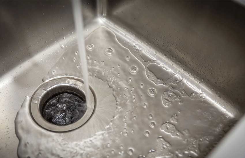 Image of a plumber at work, featuring KDP Professional Plumbing Services and highlighting the range of plumbing solutions offered on their website.